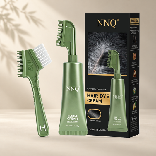 NNQ Natural Black 80 g hair dye cream, comb applicator and retail box; original product photograph on warm ivory background.